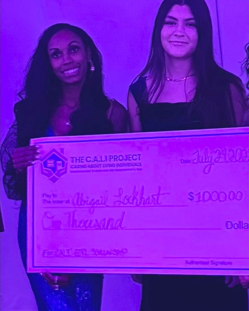 Presenting the $1,000 C.A.L.I. Girl Scholarship check at the C.A.L.I. Project gala